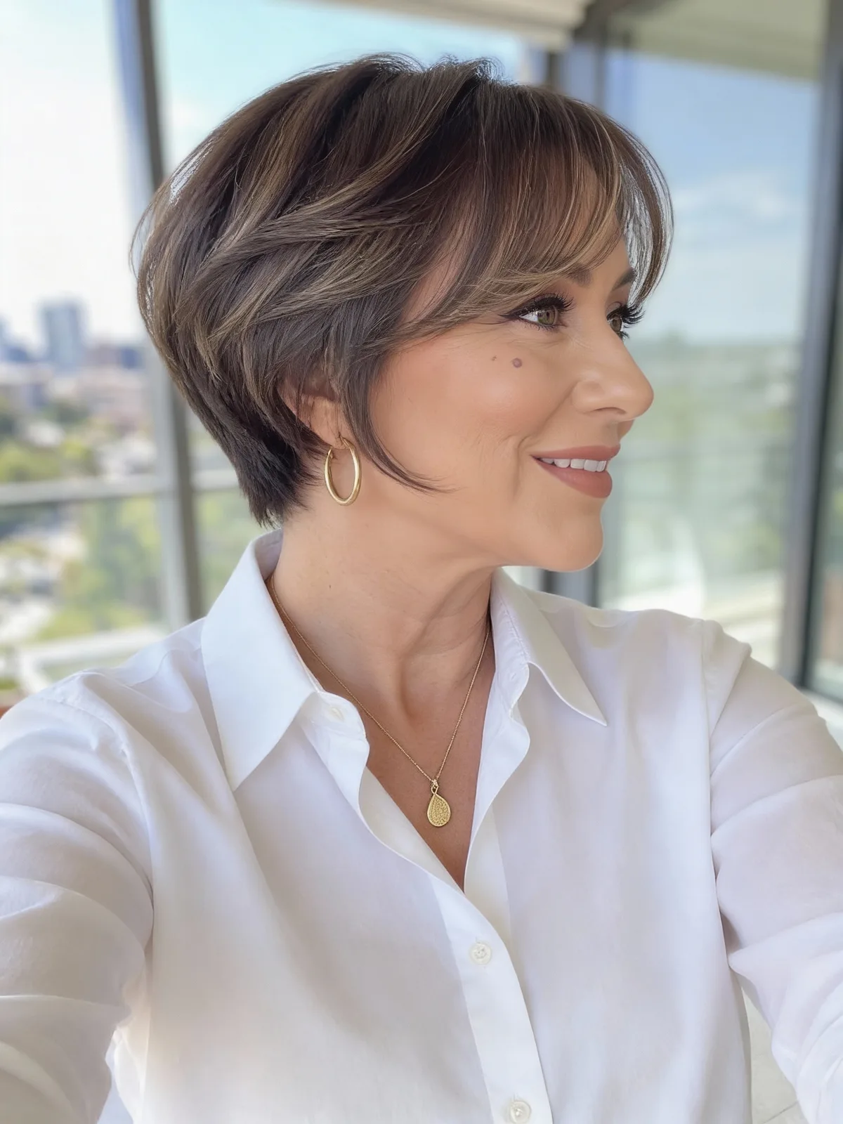 Cool Brunette Layered Pixie with Caramel Highlights